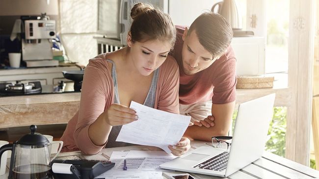 Couple looking at mortgage denial letter